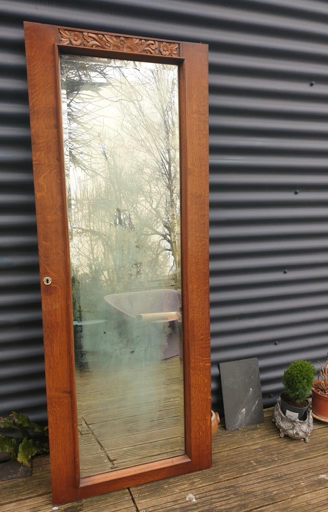 Art Deco door mirror with floral pattern frame