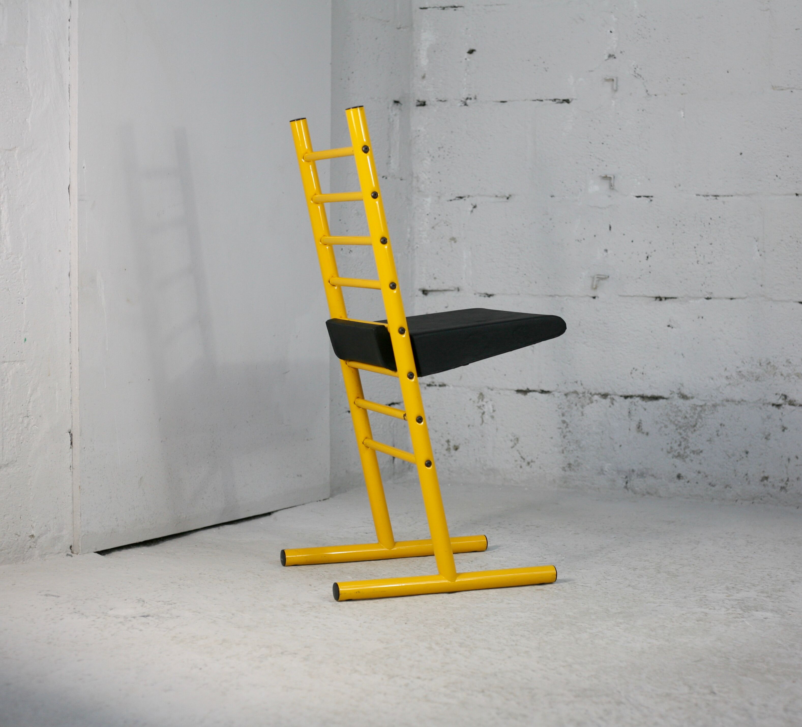 Adjustable seat chair. Circa 1980. Italy. Yellow lacquered steel.