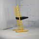 Adjustable seat chair. Circa 1980. Italy. Yellow lacquered steel.