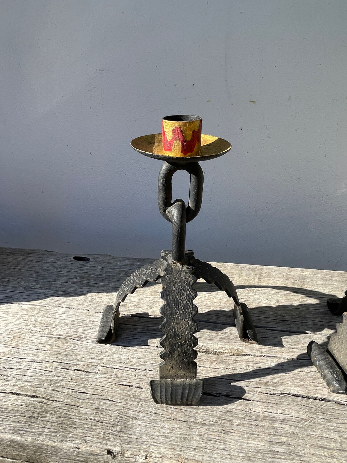 Pair of candlesticks with wrought iron chain