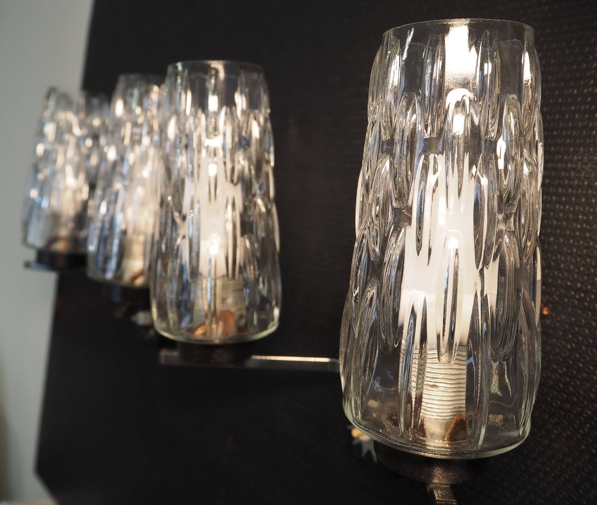 Pair of wall lights from the 1950s-1960s with a push button switch.