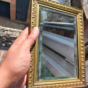 Small vintage mirror in gilded wood, bevelled glass with chain.