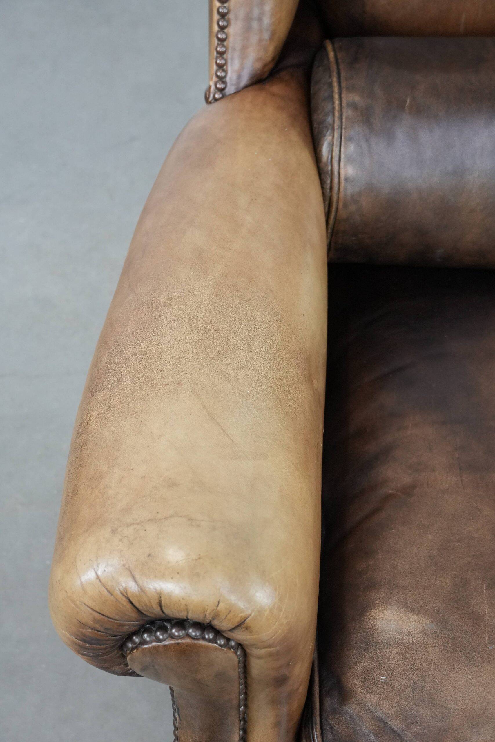 Luxury and large cowhide leather wingback chair in English style