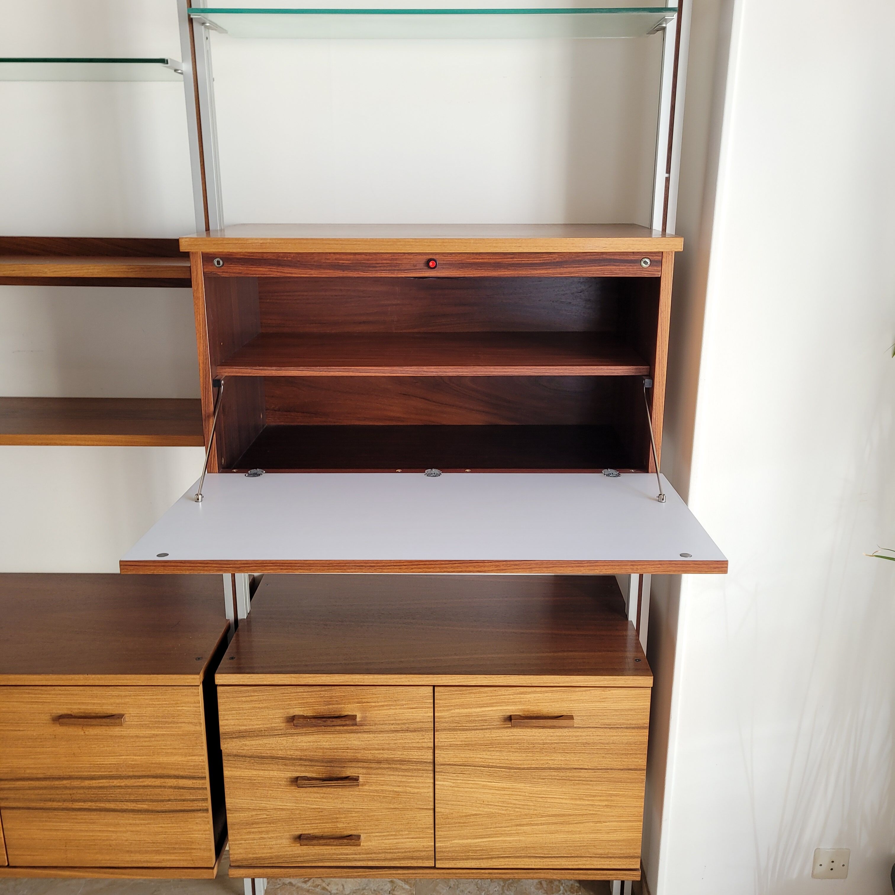 Large Scandinavian wall-mounted wood and aluminum bookcase circa 1960