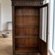 Antique oak display cabinet, solid, in the style of Spanish Renaissance, with sculpture and wrought iron.