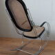 Rocking chair in chrome metal and wood