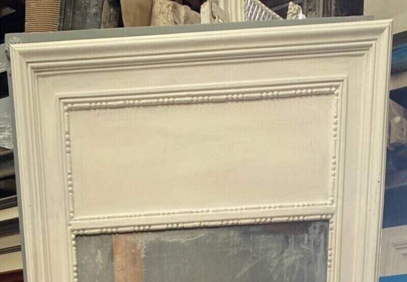 Louis XVI style mirror in wood and patinated stucco 20th century