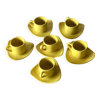 6 yellow ceramic coffee cups and saucers