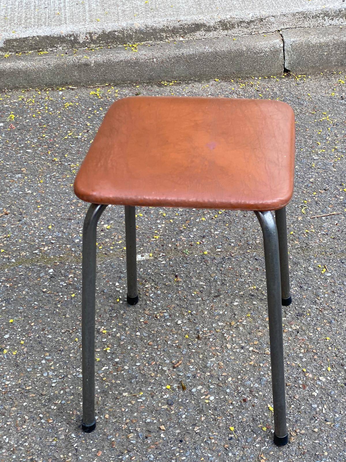 Vintage square stool in steel and brown leather.