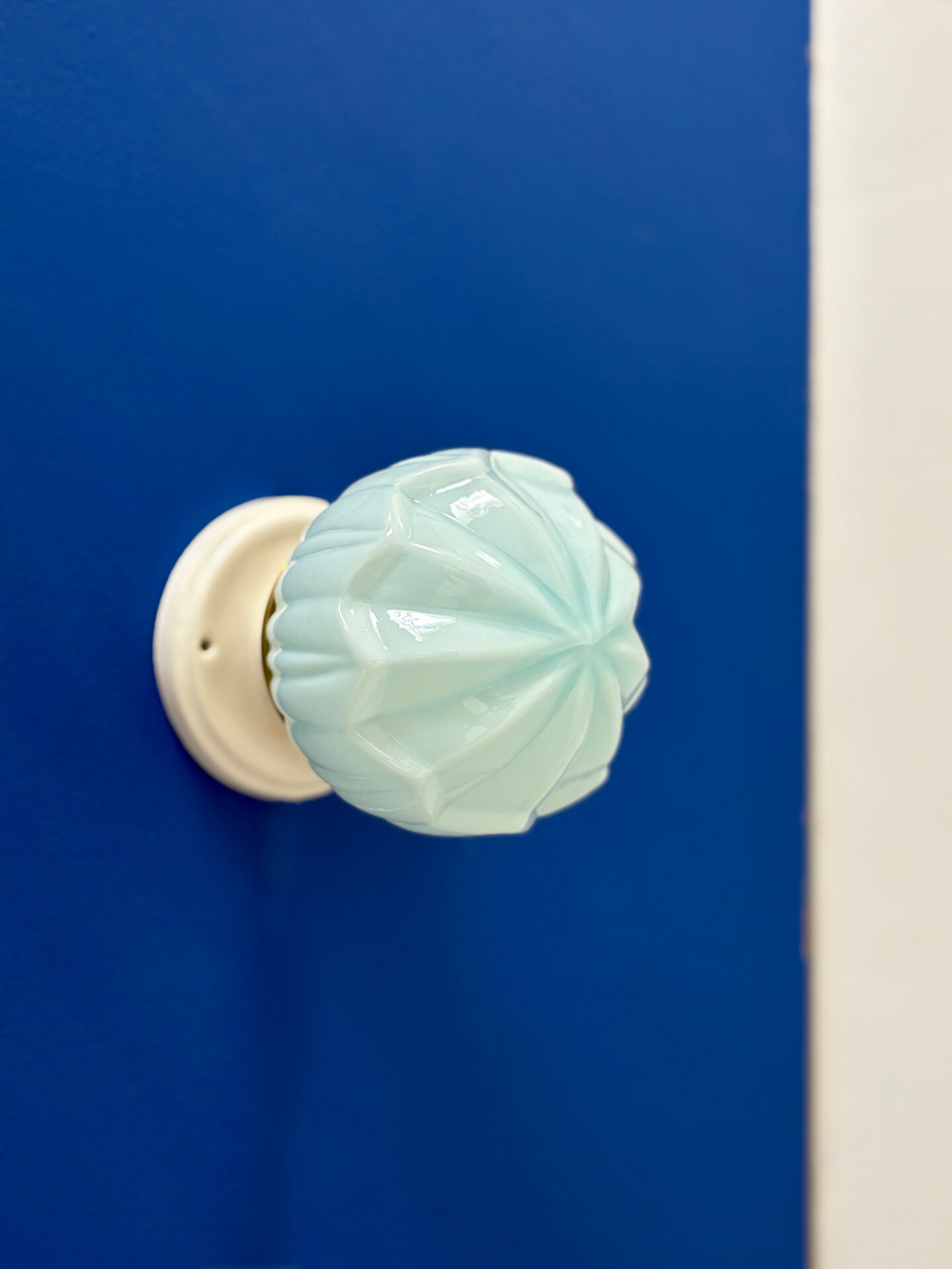 Vintage Art Deco globe wall light in blue opaline.