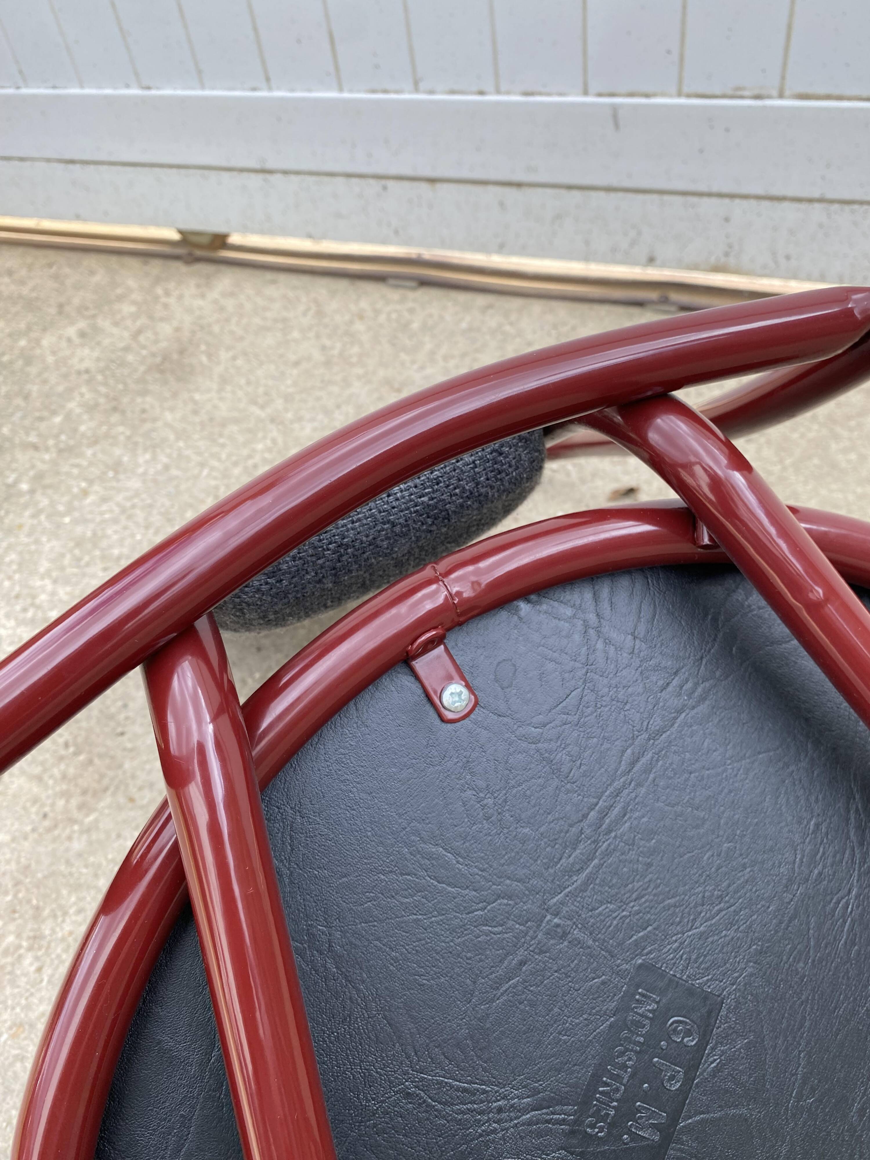 Metallic burgundy bistro chair for restaurants and communities with gray fabric