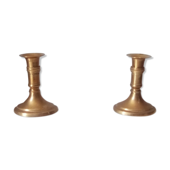 Pair of candlesticks in solid brass golden