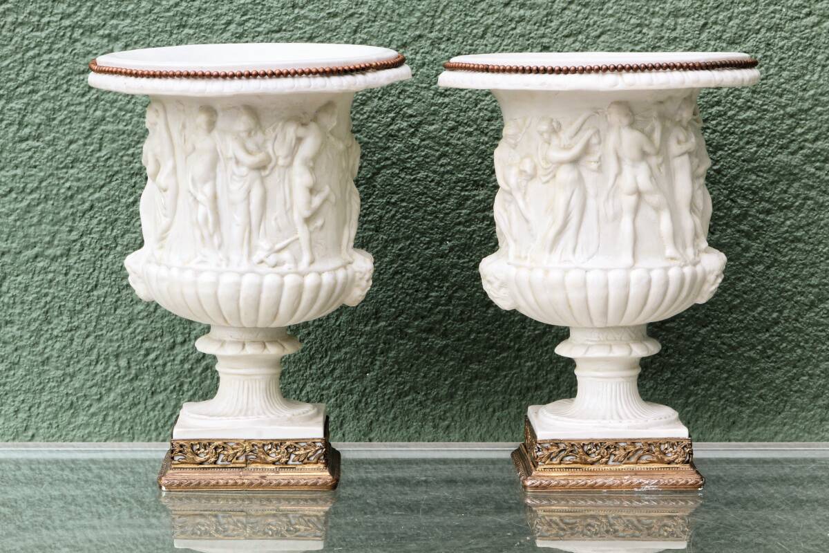 Pair of Medicis Borghese vases in porcelain biscuit and brass.