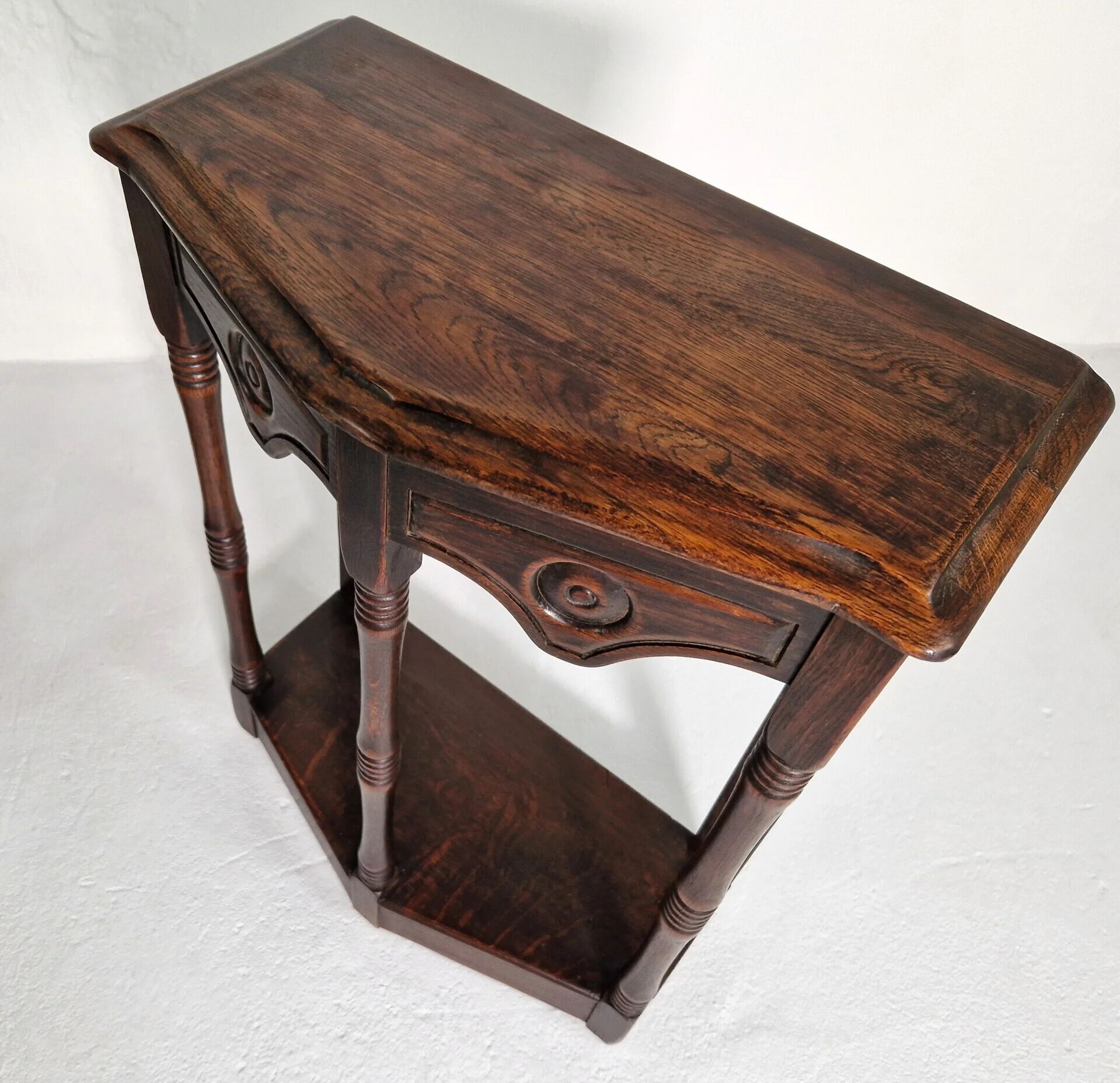 Pair of English 1920s carved oak sidetables