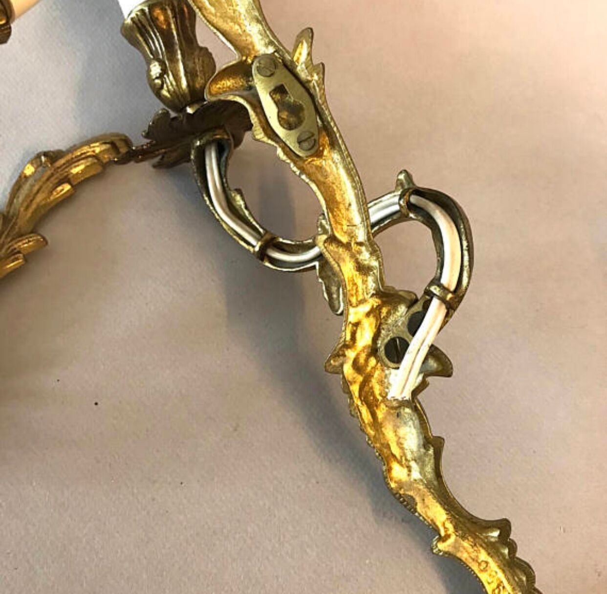 A pair of rococo gilded wall lights