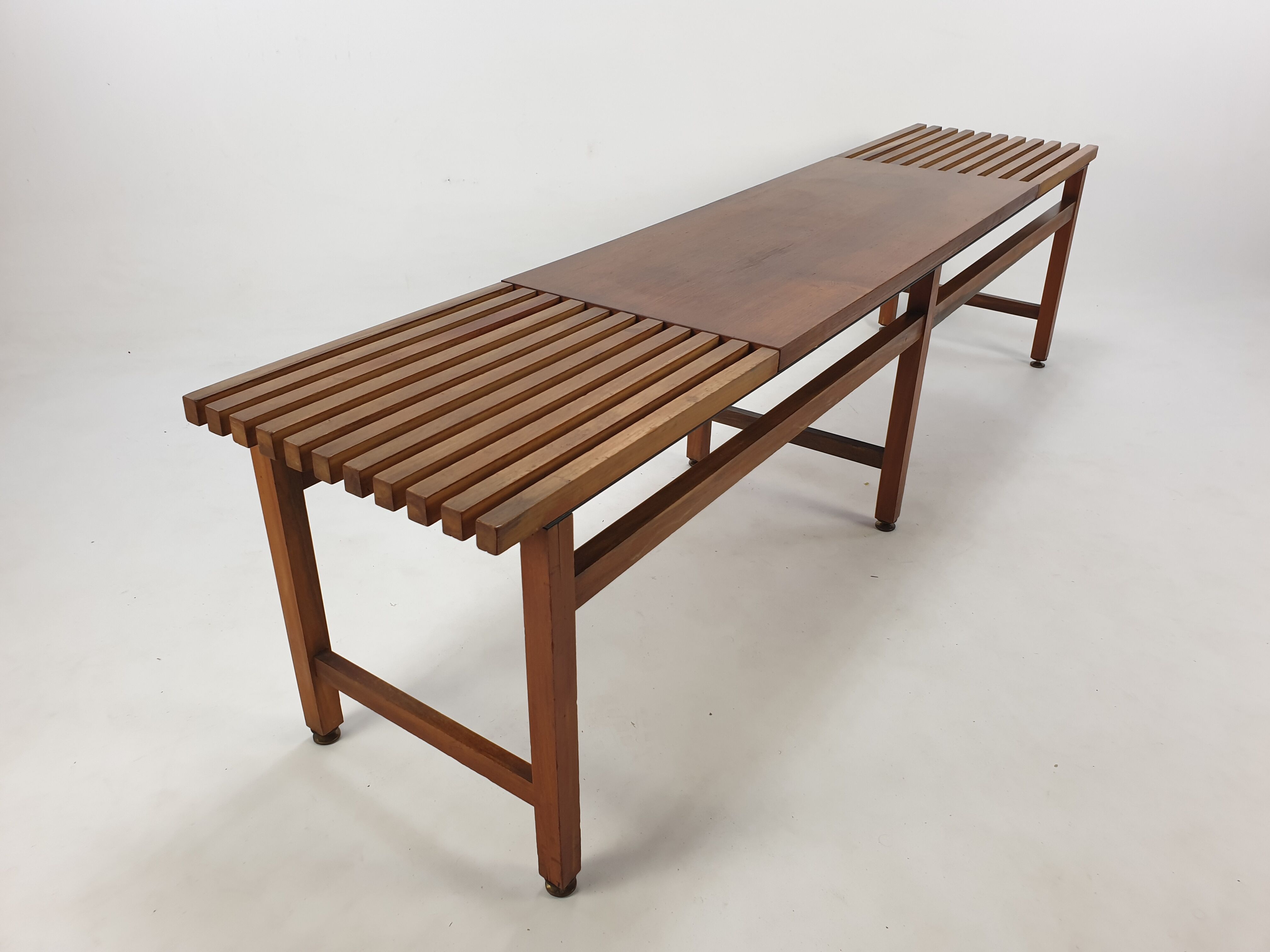 Bench in walnut and teak with brass feet, italy 1950s