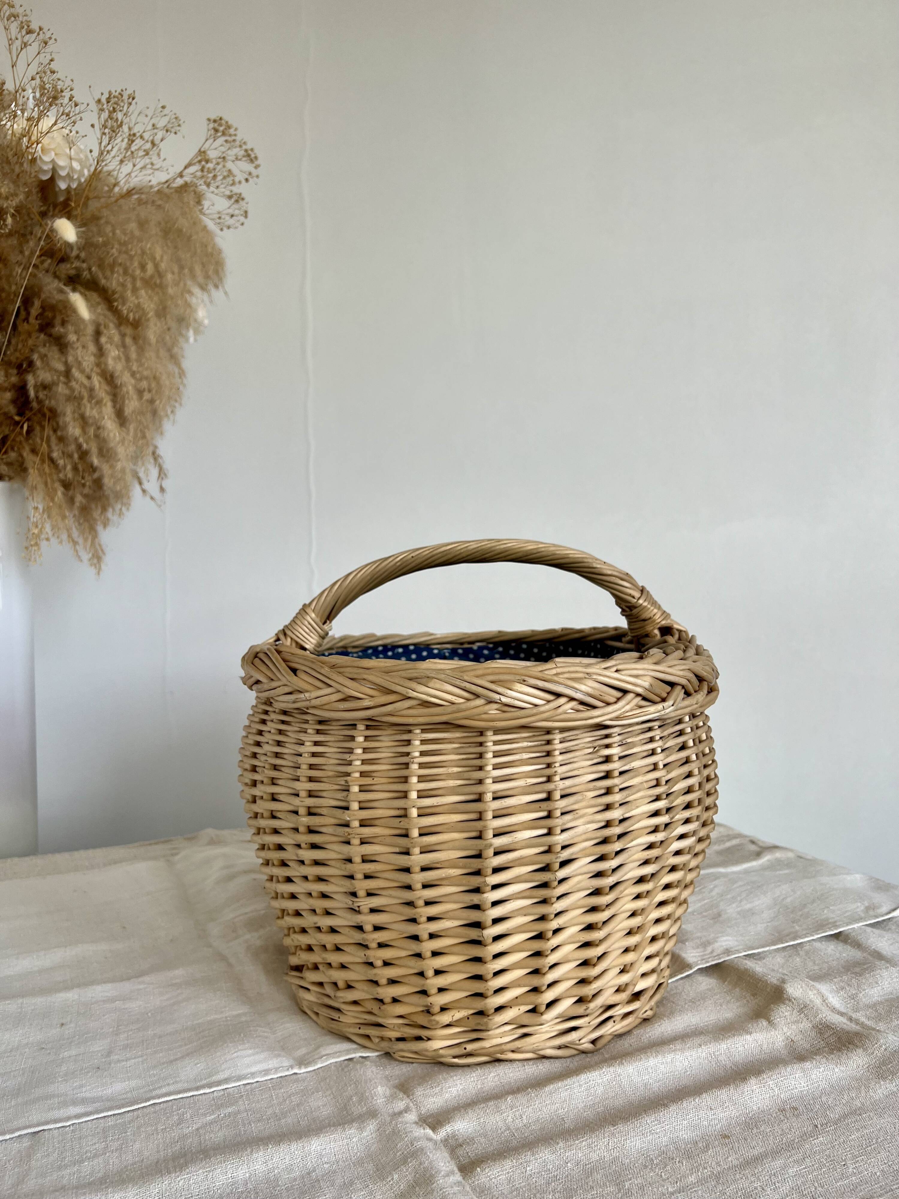 Large vintage wicker basket and blue lining with white polka dots