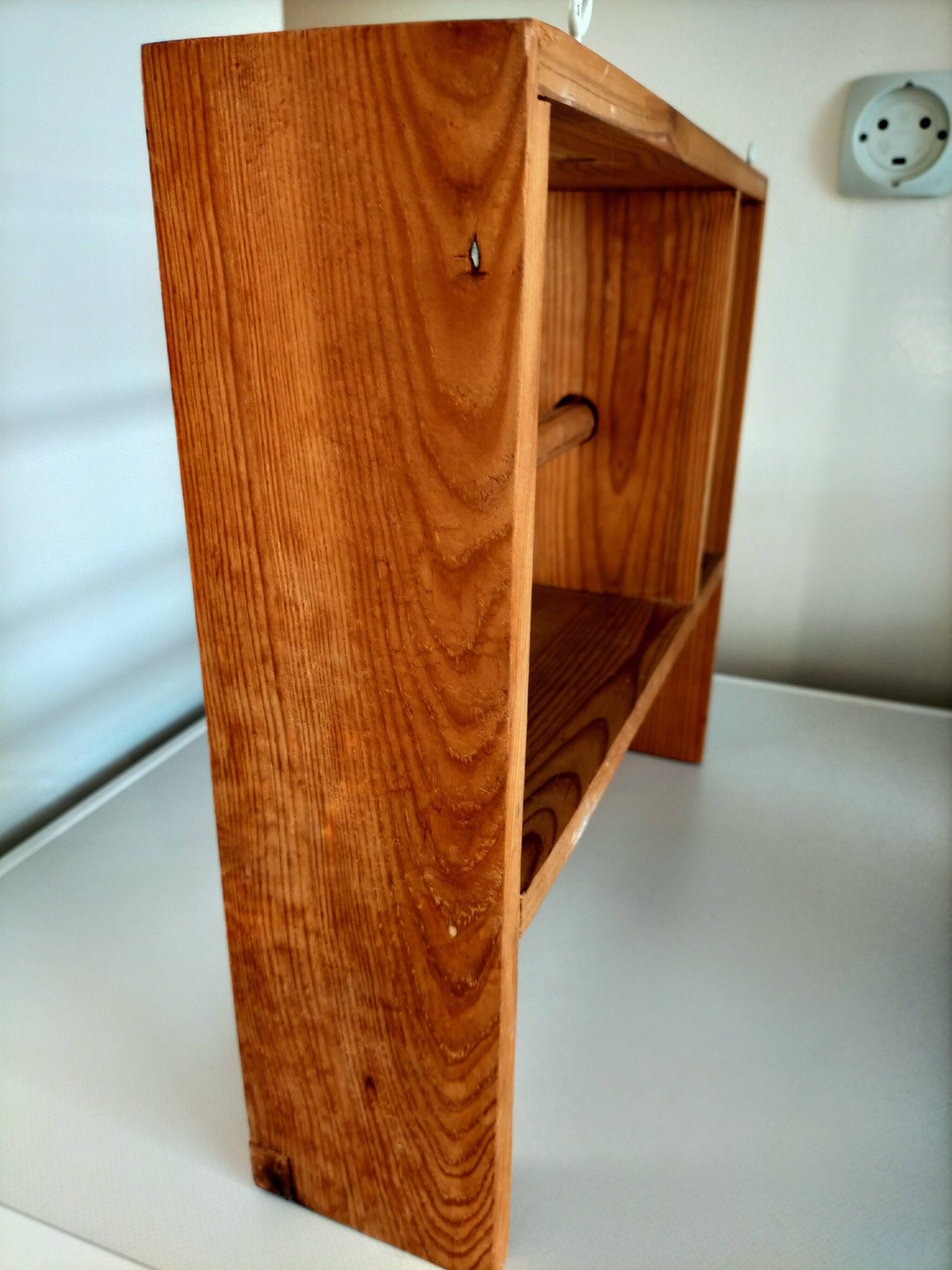 Wooden shelf with unroller wipes everything