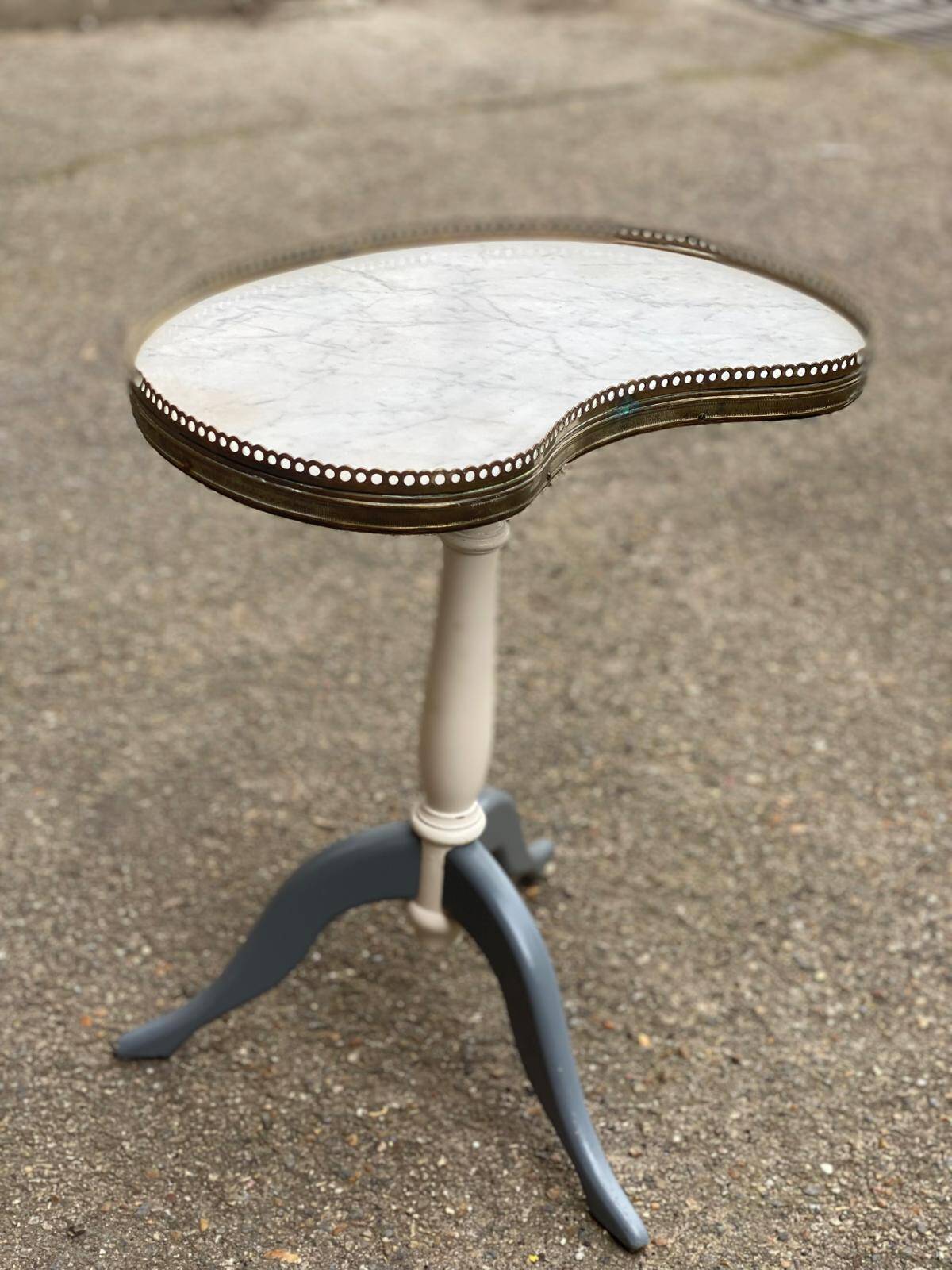 Pair of marble and ivory tripod pedestal tables