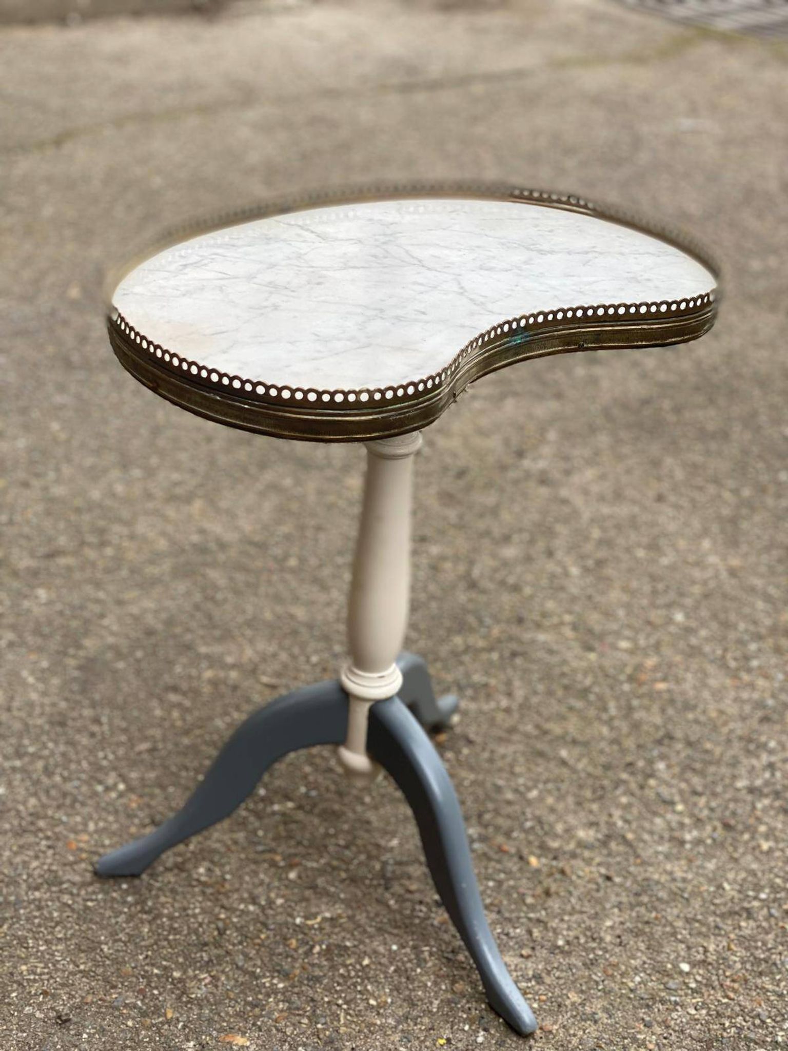 Pair of marble and ivory tripod pedestal tables