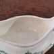 Gravy boat with white and green earthenware handle