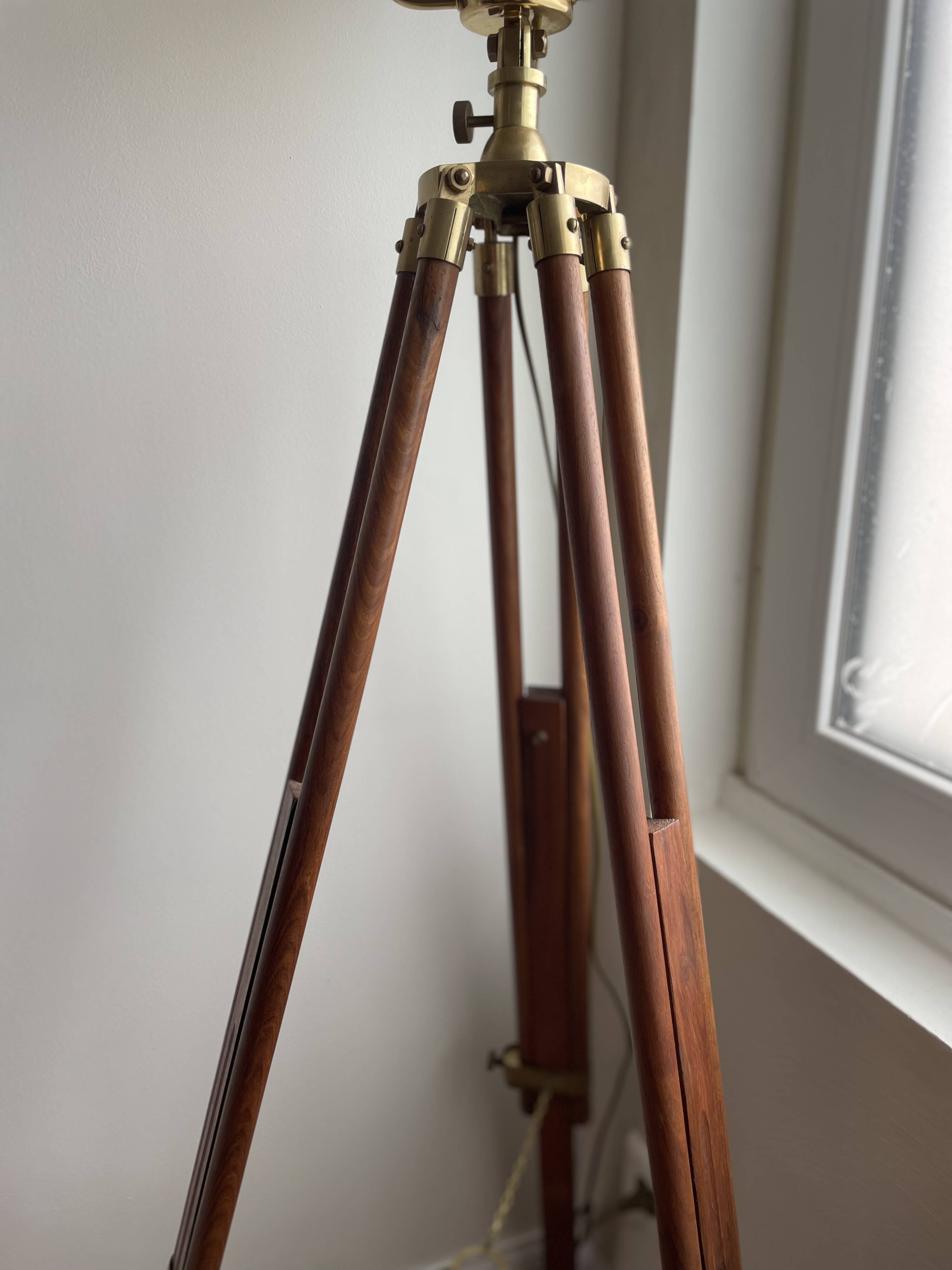 Vintage wooden and brass tripod lamp in marine style.