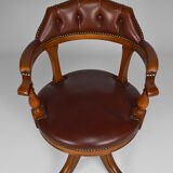 Swivel Chesterfield armchair in wood and leather