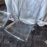 2 transparent plexiglass chairs