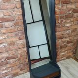 A renovated mirror in a wooden frame with a drawer and a shelf