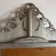 Large antique baroque mirror with angel decorations.