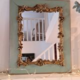 Miroir ancien de style Louis XV en bois et stuc doré.