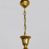 Art Nouveau style chandelier in brass with pendants and glass globe with 3 lights. Italy 70s 80s