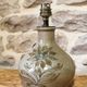 Ceramic lamp base with flower decoration
