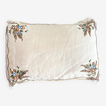 Old embroidered linen cushion
