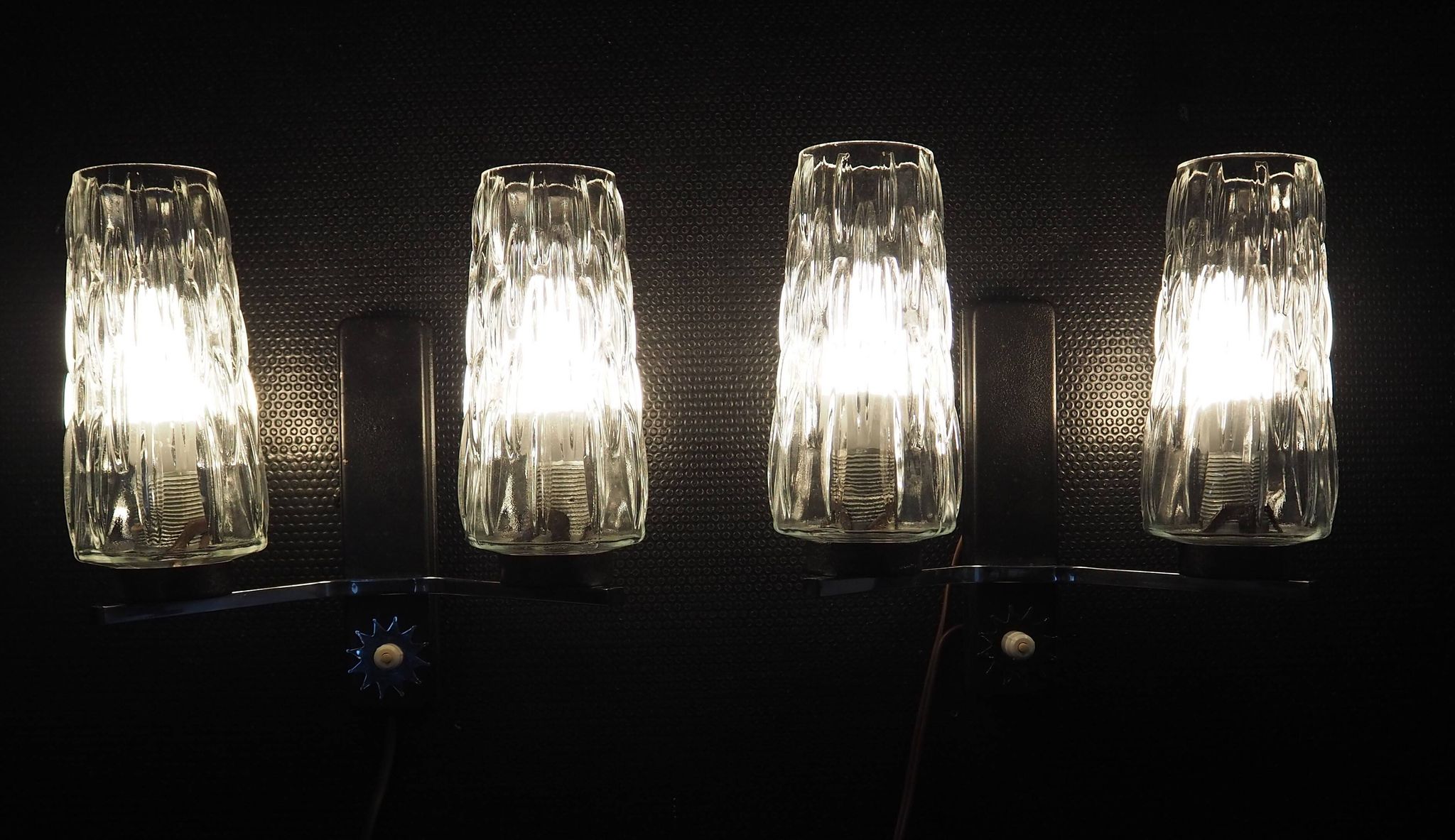 Pair of wall lights from the 1950s-1960s with a push button switch.