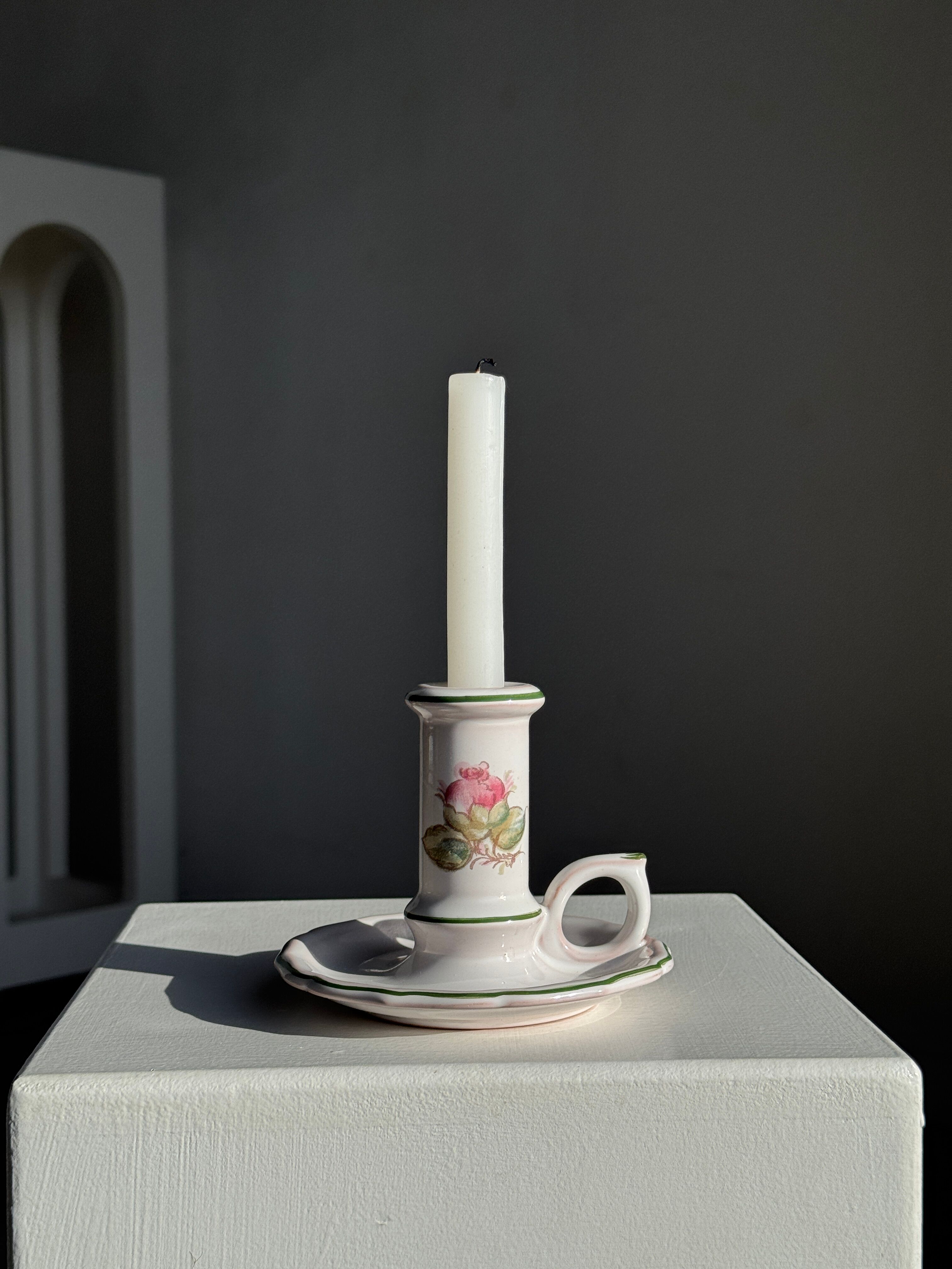 Small vintage hand-held candlestick in earthenware with green trim and floral decoration H10.5