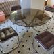 Round kitchen table with smoked glass top and 4 chairs from the 1970s.