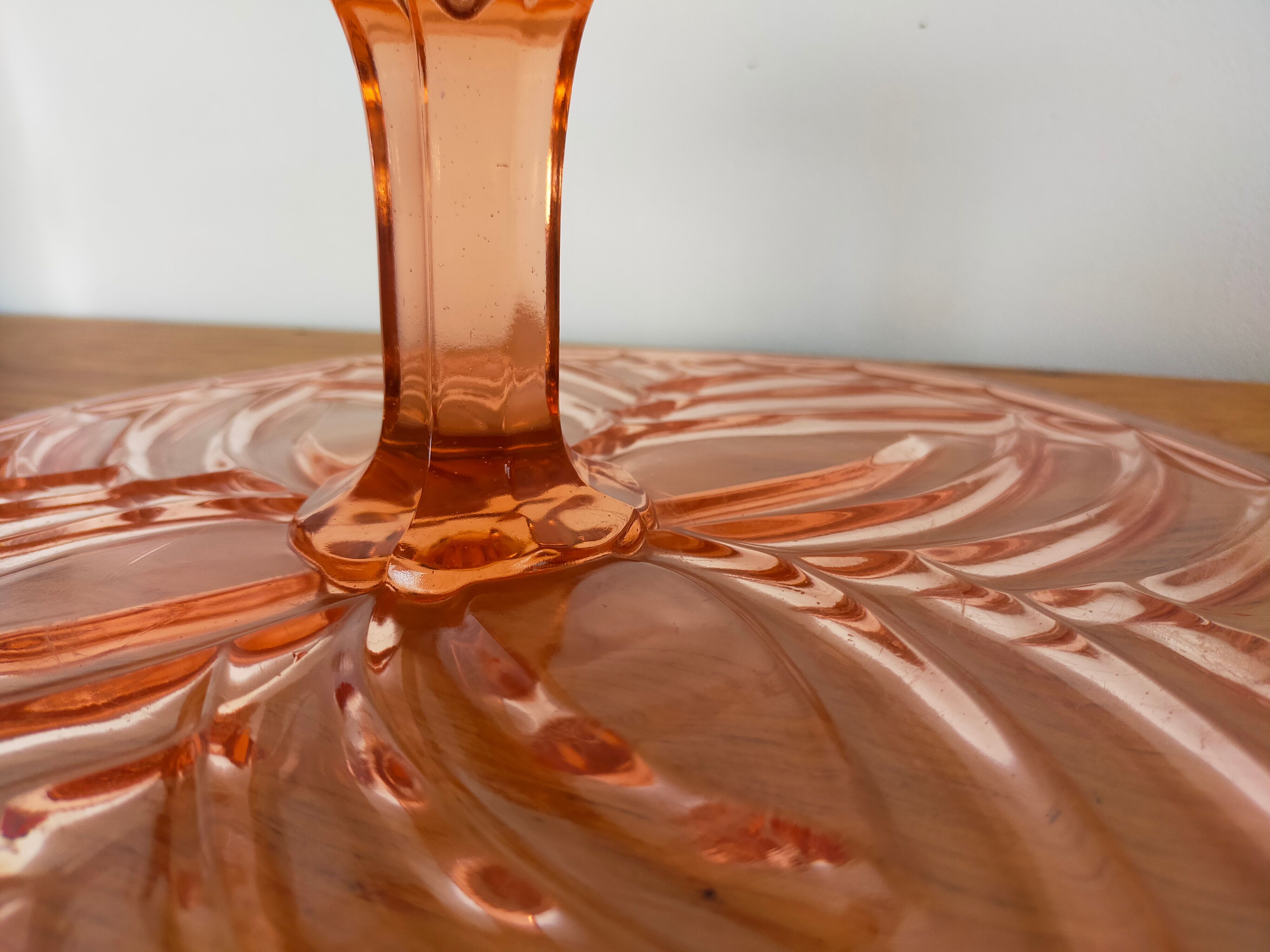 Vintage cake display in pink art deco molded glass