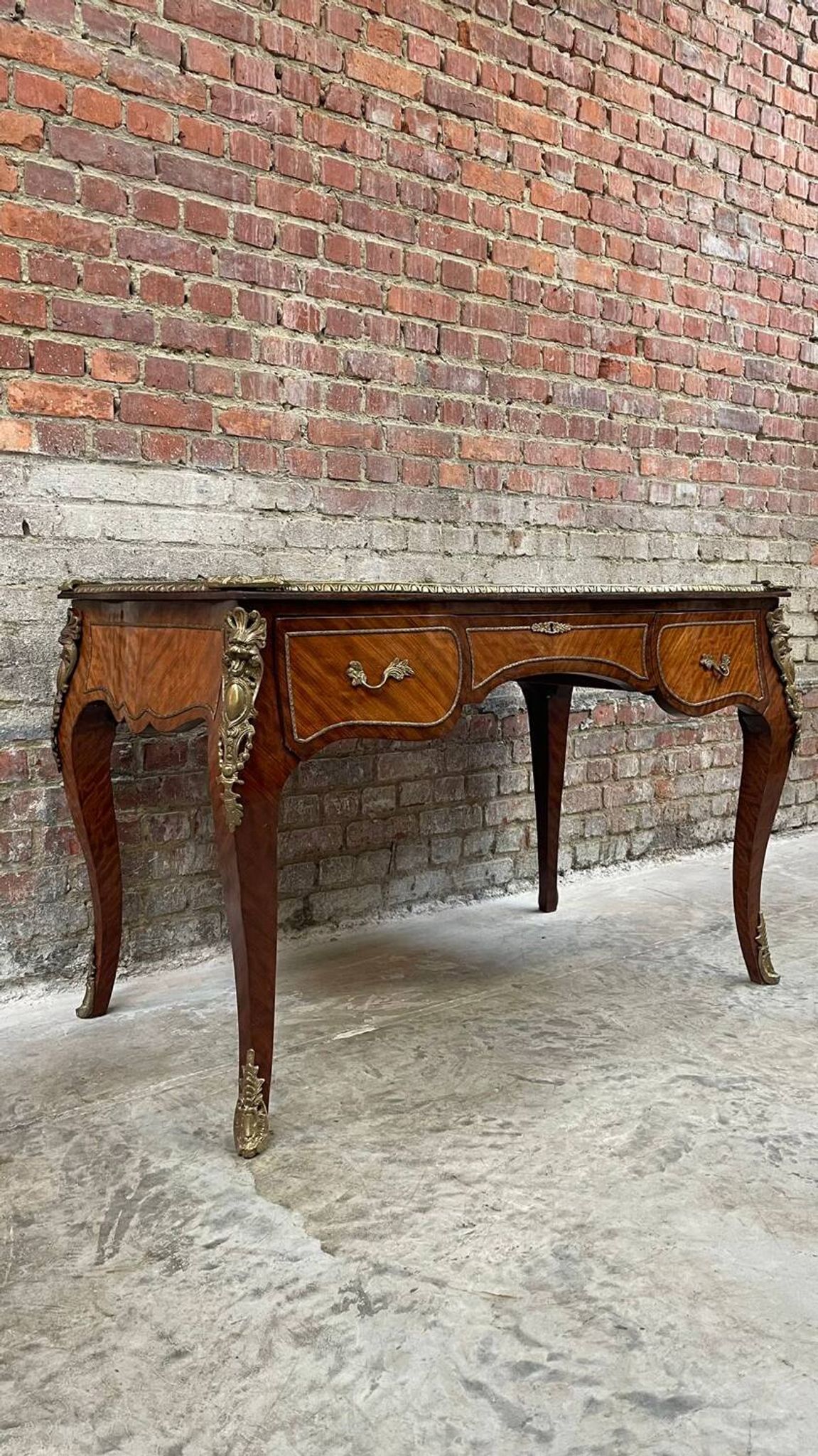 Antique French-style desk with green leather top and bronze mounts