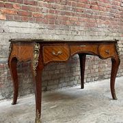 Antique French-style desk with green leather top and bronze mounts