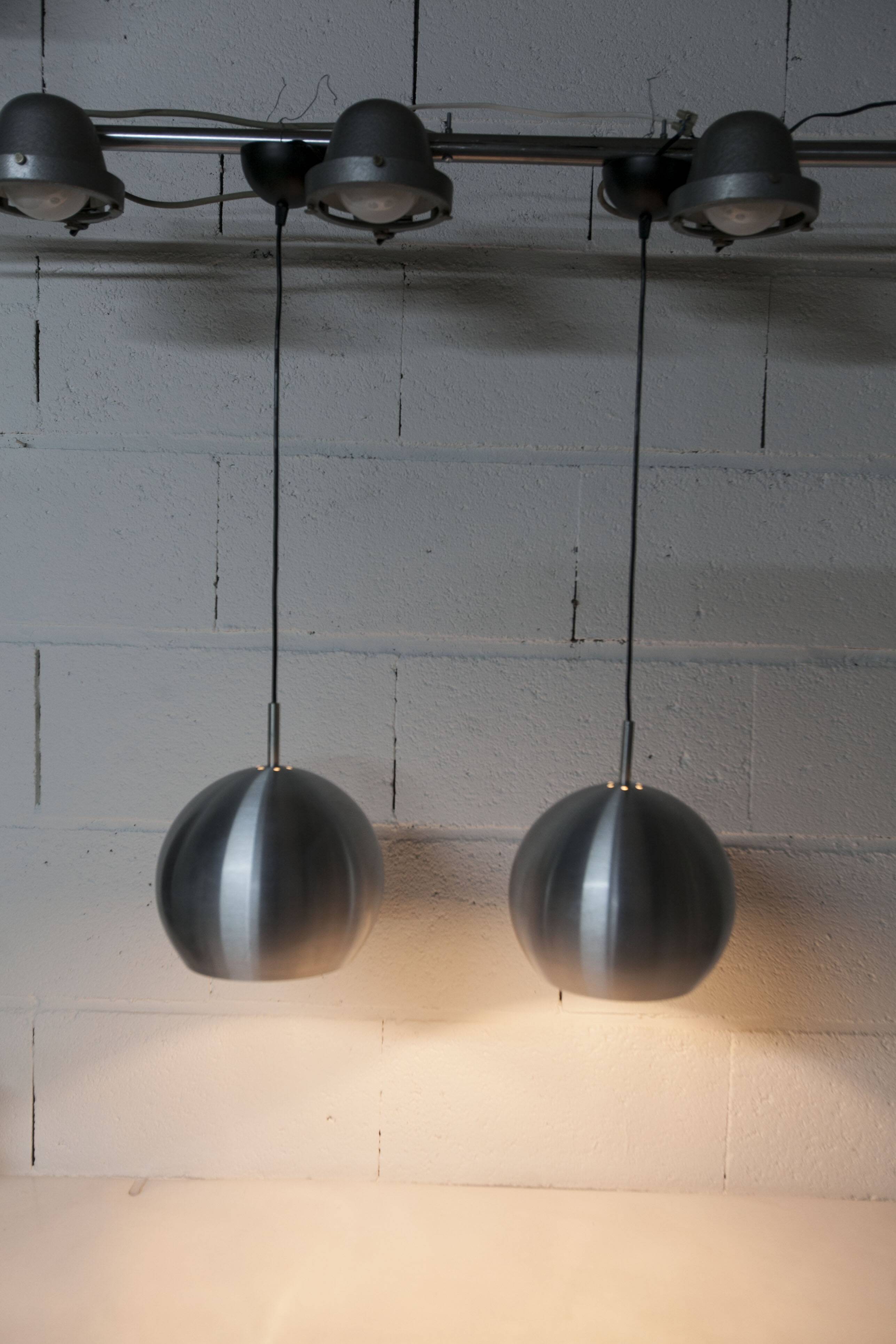 Pair of functional 70's aluminum ball pendants