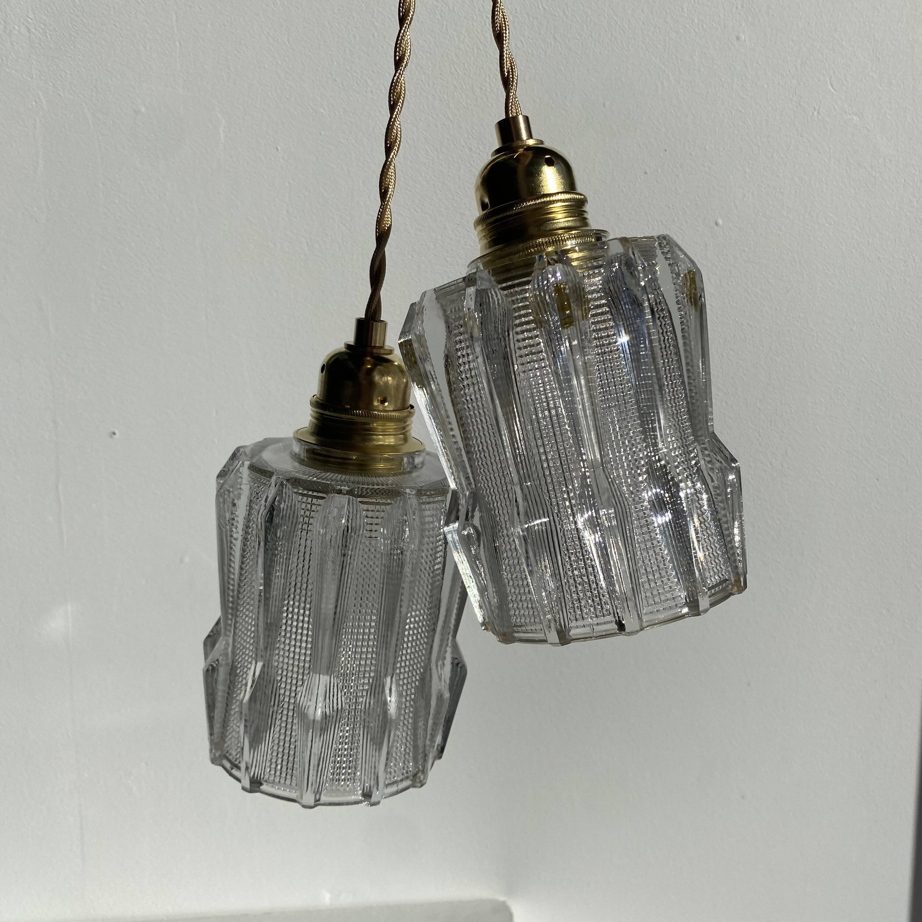Pair of Art Deco pendant lights in molded pressed glass