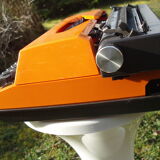 Electric writing machine adler orange and black with its suitcase