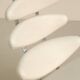 "Corona" lounge chair in off-white grained leather by Poul Volther for E