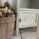 White patinated bedside table with a marble top