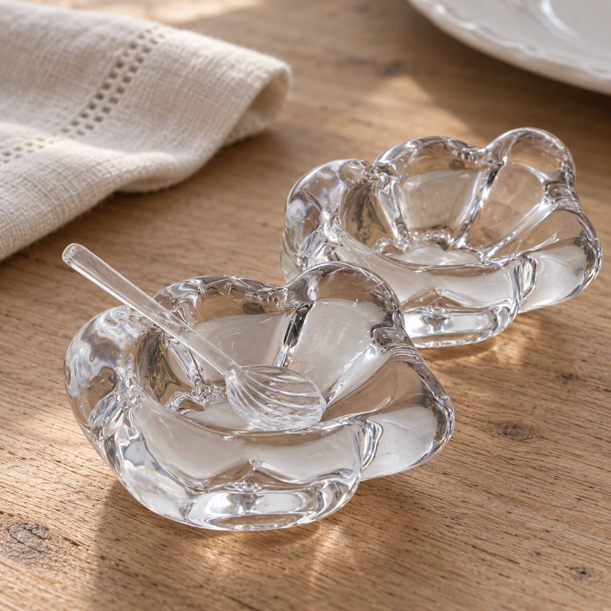 Pair of crystal salt cellars from Daum France with box and spoon.