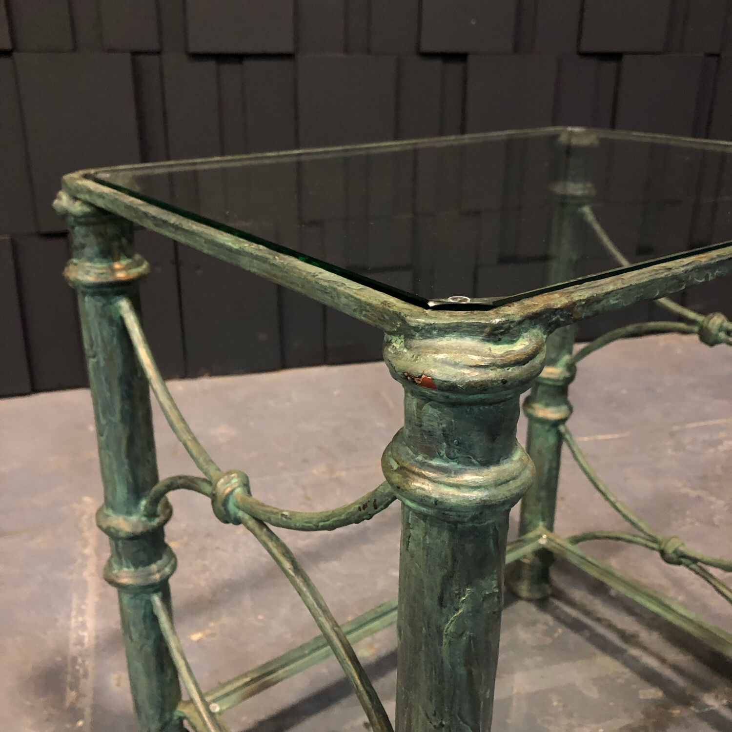 Iron and glass side table with antique patina