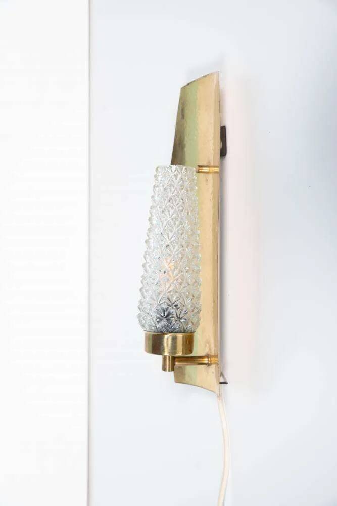 Vintage glass wall sconce from the 1960s in brass, mid-century light.