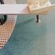 White opaque glass ceiling light and golden metal sun