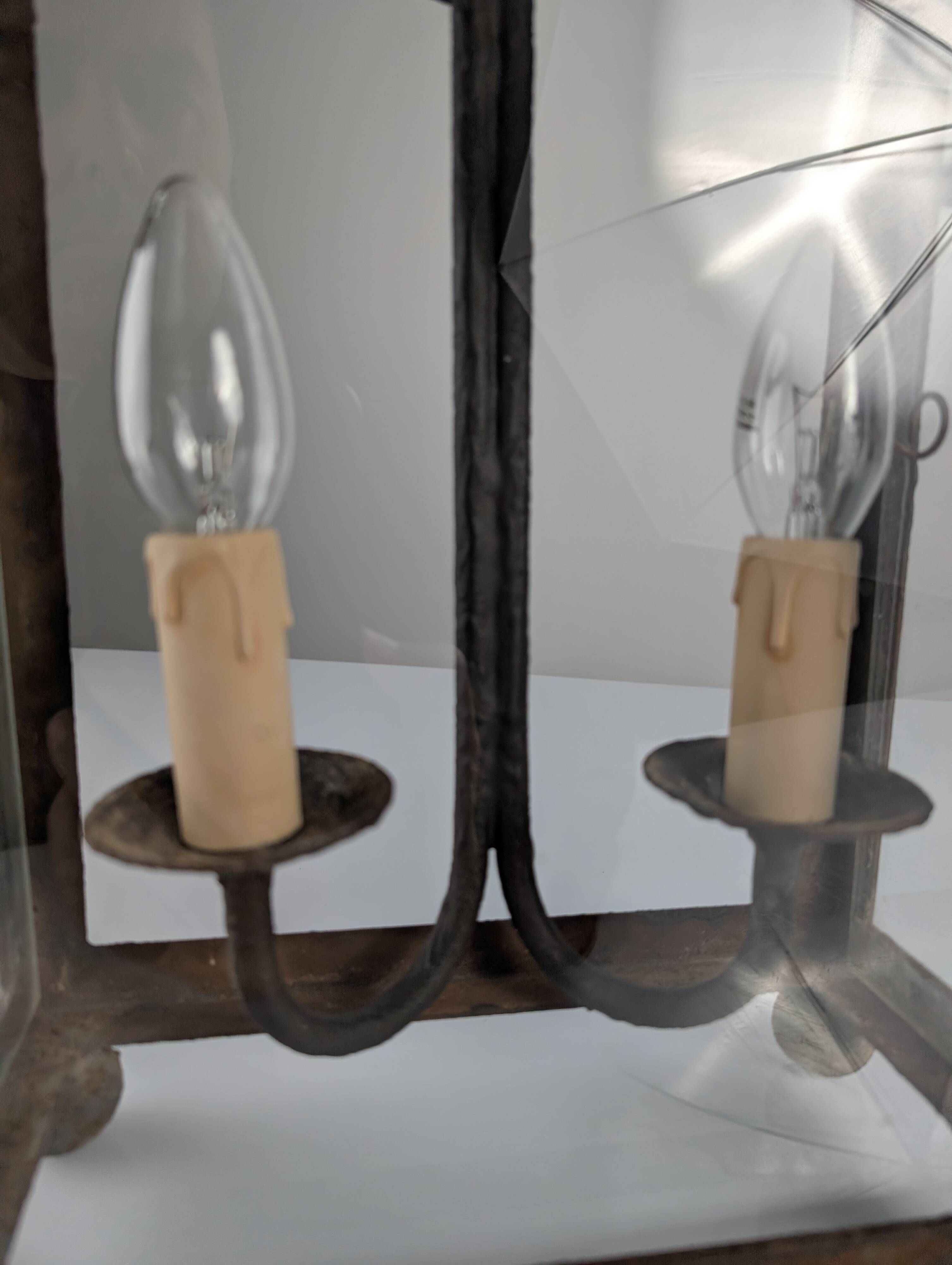 Wrought iron lantern with glass panels, leaf motifs